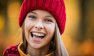 Girl smiling after seeing children's dentist in Marlton
