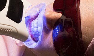 Patient undergoing in-practice teeth whitening