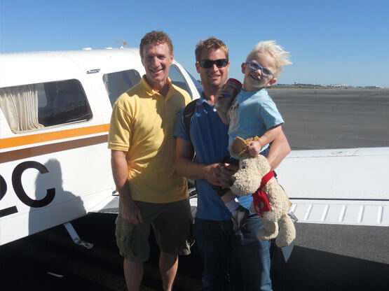 Marlton family dentist Doctor Sandberg in front of Angel Flight plane