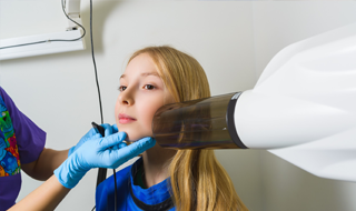 Child receiving dental x-rays