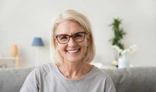 a woman in Marlton smiling after receiving dental crowns