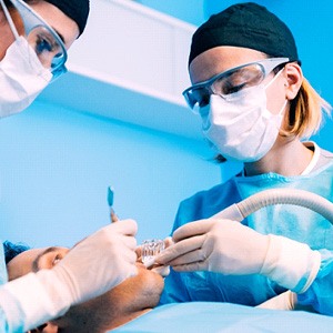 Dentists performing surgery