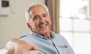 patient smiling after getting dental implants in Marlton