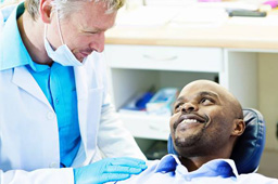 Smiling man in dental chair