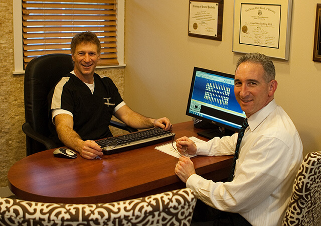 Marlton family dentist Doctor Sandberg and dental patient in consultation room