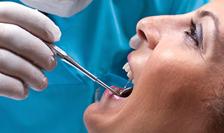 Dental patient receiving preventive dentistry checkup and teeth cleaning