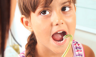 little girl getting dental checkup