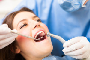 A woman receiving dental treatment