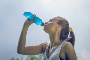 person drinking a sports drink