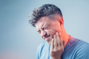 man with mouth pain