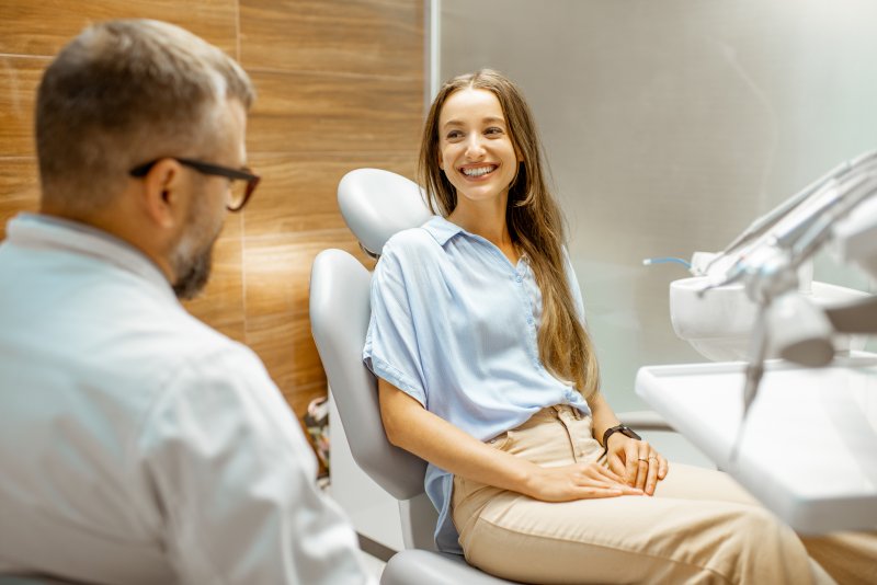 Patient smiling at dentist during cosmetic dental consultation