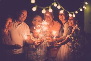 a group of people with healthy smiles at New Year's eve