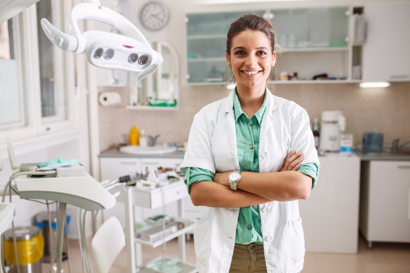 Female dentist smiles